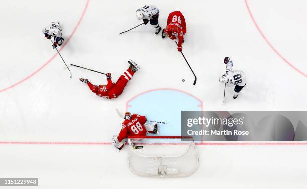 Mikhail Sergachyov of Russia challenges Patrick Kane of United States during the 2019 IIHF Ice Hockey World Championship Slovakia quarter final game...