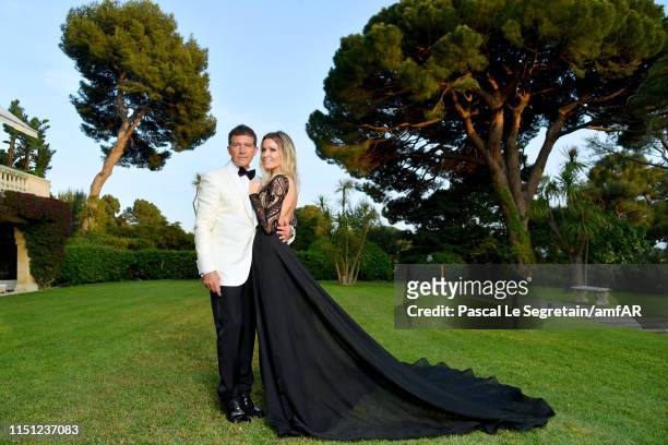 Antonio Banderas and Nicole Kimpel attend the amfAR Cannes Gala 2019 at Hotel du Cap-Eden-Roc on May 23, 2019 in Cap d'Antibes, France.
