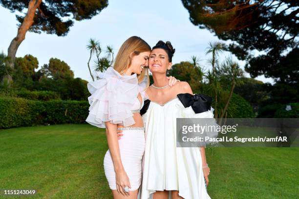And Giovanna Battaglia and Bianca Brandolini attend the amfAR Cannes Gala 2019 at Hotel du Cap-Eden-Roc on May 23, 2019 in Cap d'Antibes, France.