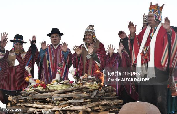Bolivian President Evo Morales makes an offering to the Pachamama during a ceremony on the Aymara New Year, on June 21, 2019 in Tiwanaku, 70 km from...