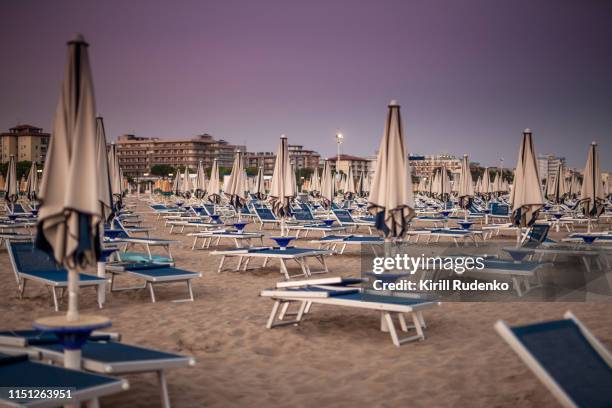 sand beach at night in bibione, italy - bibione stock pictures, royalty-free photos & images