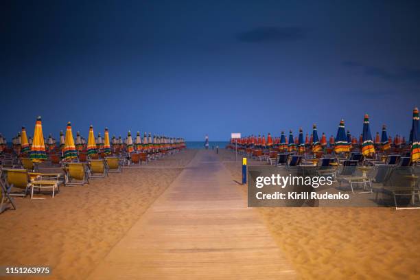 sand beach at night - bibione stock pictures, royalty-free photos & images