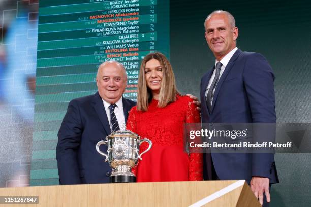 President of French Tennis Federation Bernard Giudicelli, Simona Halep and Director of Roland Garros tournament Guy Forget attend the 2019 Tennis...