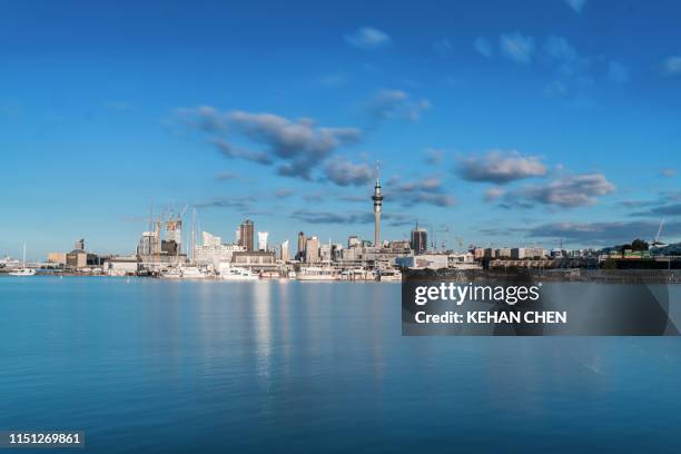 reflection of buildings in lake against sky in auckland city - auckland light path stock pictures, royalty-free photos & images