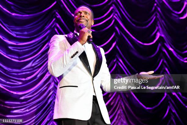 Comedian Chris Tucker performs during the amfAR Cannes Gala 2019 at Hotel du Cap-Eden-Roc on May 23, 2019 in Cap d'Antibes, France.