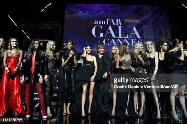 Models are seen on stage during the amfAR Cannes Gala 2019 at Hotel du Cap-Eden-Roc on May 23, 2019 in Cap d'Antibes, France.