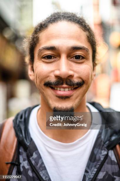 portrait of man with goatee and moustache smiling - goatee stock pictures, royalty-free photos & images