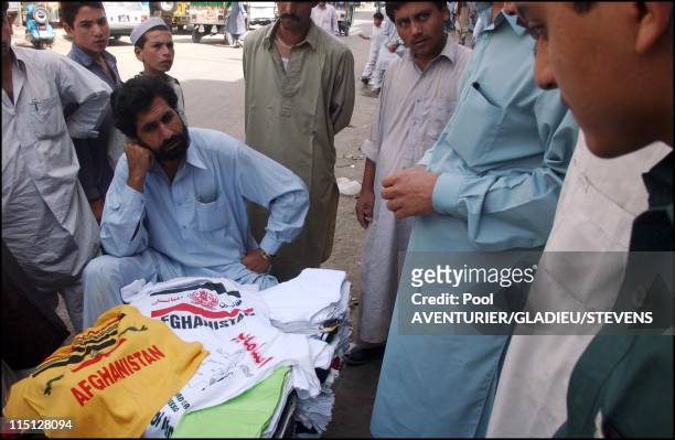 Daily life in Peshawar, Pakistan on September 16, 2001 - Tee shirts bearing slogans Glorifiing Bin Laden struggle.