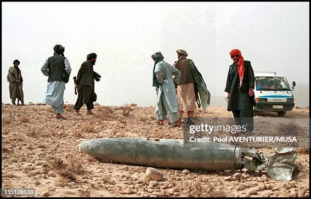 Daily life near Kandahar after US bombing in Kandahar, Afghanistan on November 02, 2001 - An unexploded bomb dropped, most probably from a US B52...