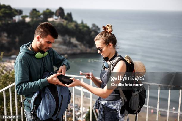 hikers setting up music on bluetooth speaker and smart phone - bluetooth stock pictures, royalty-free photos & images