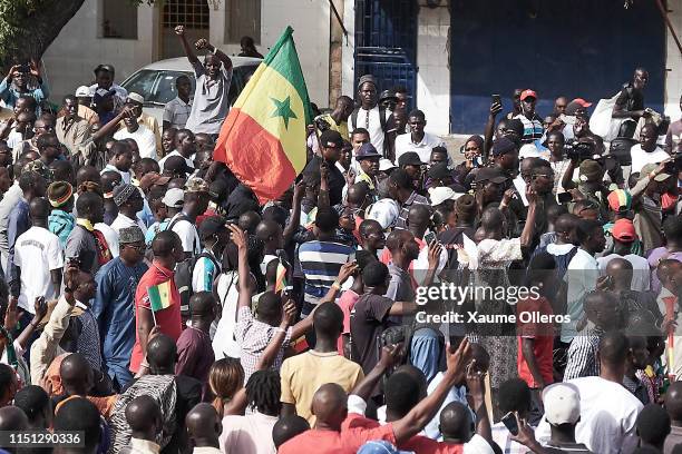 Opposition leader and former presidential candidate Ousmane Sonko arrives surrounded by supporters at a protest against President Macky Sall after a...