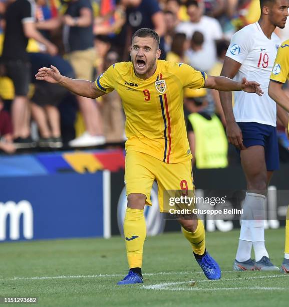 George Puscas of Romania celebrates after scoring the opening goal during the 2019 UEFA U-21 Group C match between England and Romania at Dino...