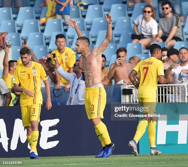 George Puscas of Romania celebrates after scoring the opening goal during the 2019 UEFA U-21 Group C match between England and Romania at Dino...
