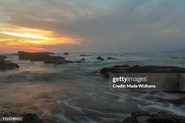 lovely bali's beach when sunset - made widhana stock pictures, royalty-free photos & images