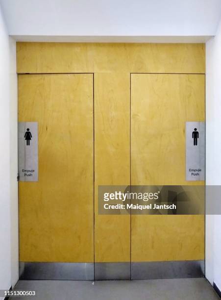 the of a bathroom - woman and men. - public restroom door stock pictures, royalty-free photos & images