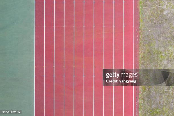 red running track - athletics texture stock pictures, royalty-free photos & images