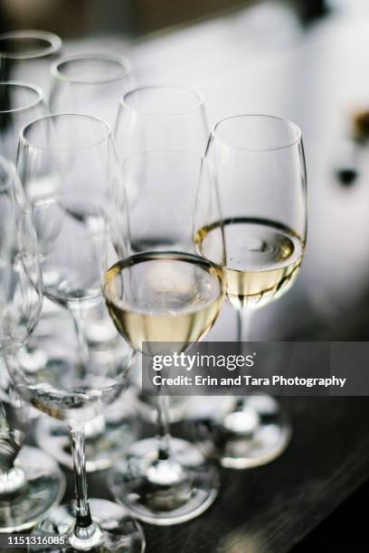 champagne flute half full with champagne - glass half full party stock-fotos und bilder