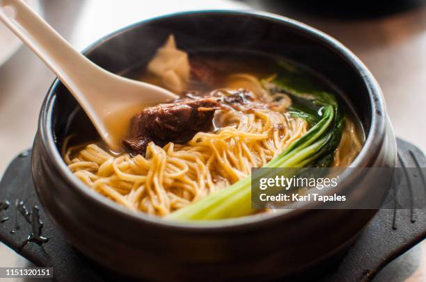 a close-up view of chinese beef noodle soup - chinese cabbage stock pictures, royalty-free photos & images