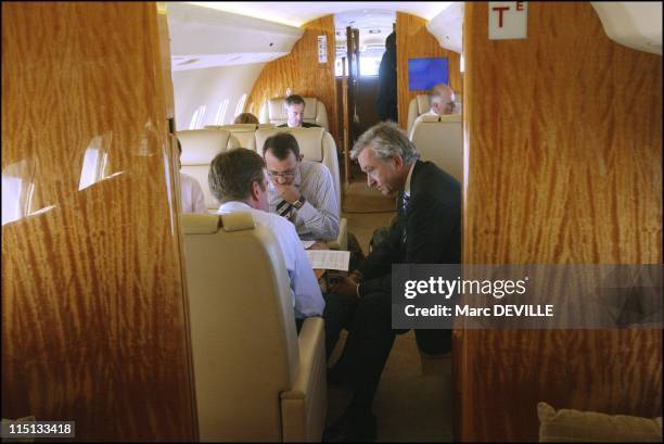 Bernard Arnault on board his private jet between Beijing and Shanghai. In Shanghai, China on October 11, 2004 - With his board: from left to right:...