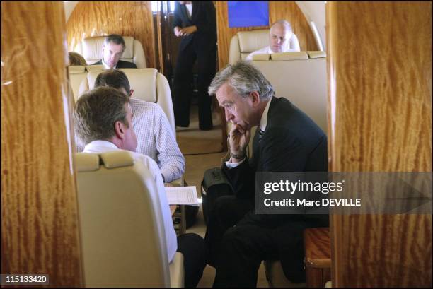 Bernard Arnault on board his private jet between Beijing and Shanghai. In Shanghai, China on October 11, 2004 - With his board: from left to right:...