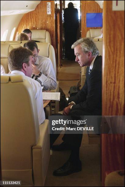 Bernard Arnault on board his private jet between Beijing and Shanghai. In Shanghai, China on October 11, 2004 - With his board: from left to right:...