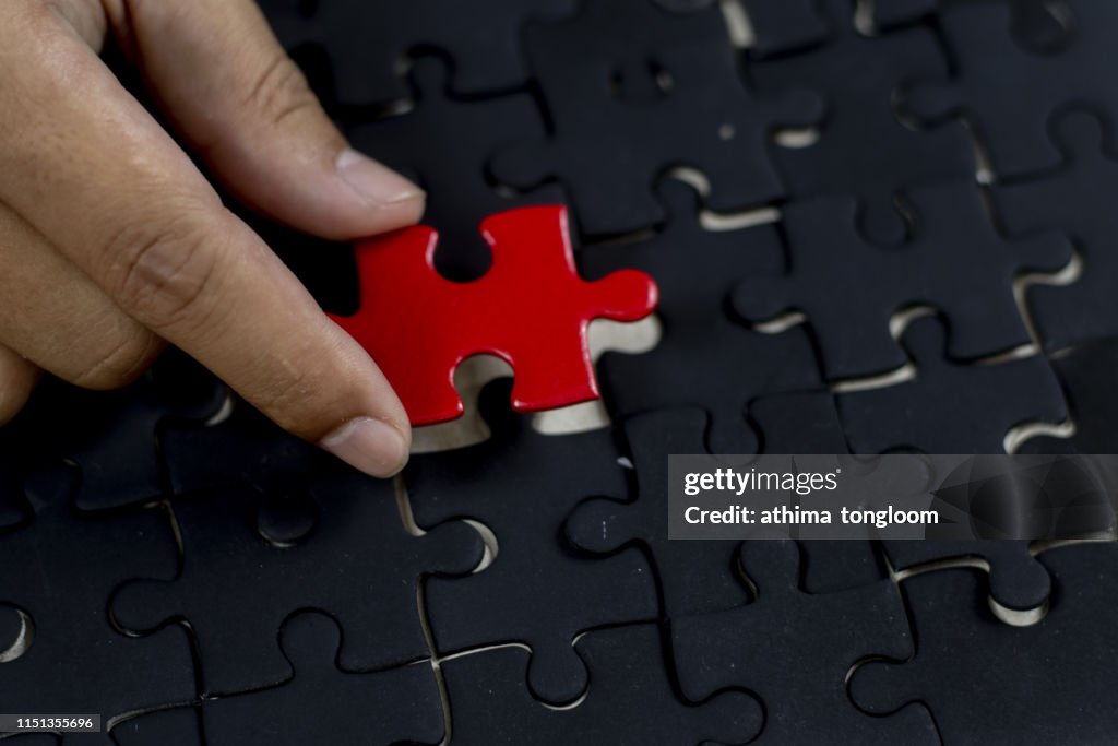 Red piece in black puzzle