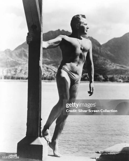 Italian Actor Rossano Brazzi In Swimming Trunks Circa 1960 italian-actor-rossano-brazzi-in-swimming-trunks-circa-1960