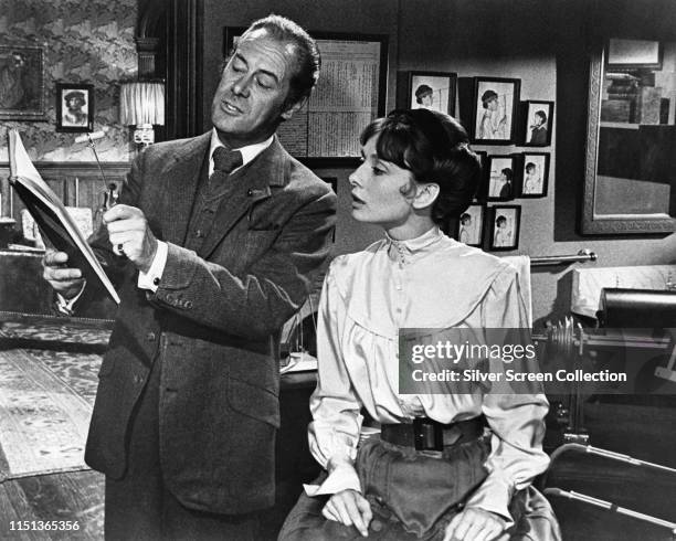 Actors Audrey Hepburn as Eliza Doolittle and Rex Harrison as Professor Henry Higgins in the musical film 'My Fair Lady', 1964.