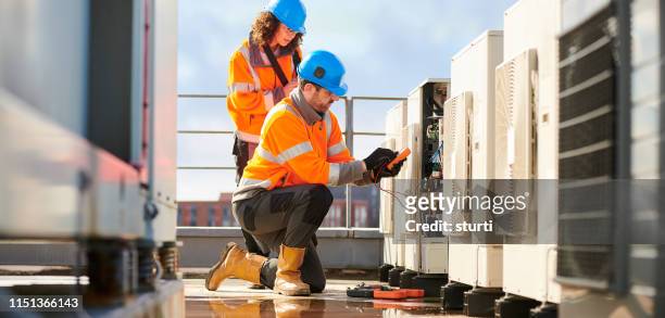 aircon engineers - repairing stock pictures, royalty-free photos & images