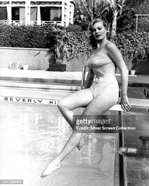 Swedish actress Anita Ekberg by a swimming pool in Beverly Hills, California, circa 1960.
