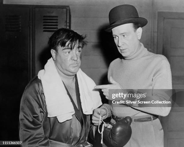 Comedy duo Lou Costello and Bud Abbott pose as a boxer and his manager in the film 'Abbott And Costello Meet The Invisible Man', 1951.