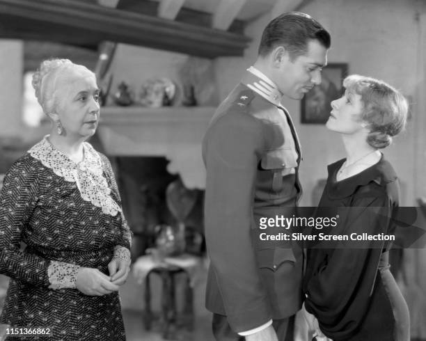 From left to right, actors Louise Closser Hale as Mina Bernardo, Clark Gable as Giovanni Severi and Helen Hayes as Angela Chiaromonte in the film...
