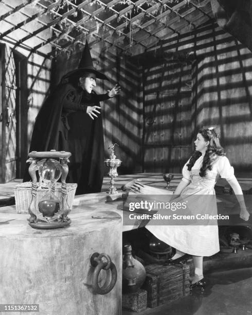 Actors Judy Garland as Dorothy and Margaret Hamilton as the Wicked Witch of the West in the musical film 'The Wizard of Oz', 1939.