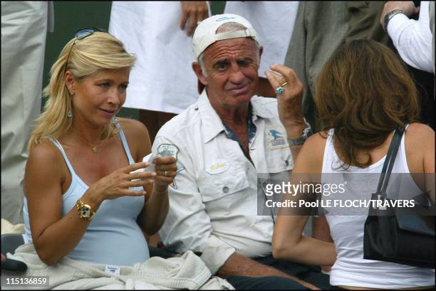 People at French tennis open at Roland Garros in Paris, France on June 05, 2003 - Jean Paul Belmondo and his wife Natty.