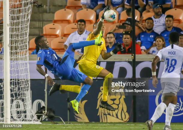 Honduras forward Rubilio Castillo attempts to volley the ball away from Curaçao goalkeeper Eloy Room during the CONCACAF Gold Cup Group C match...