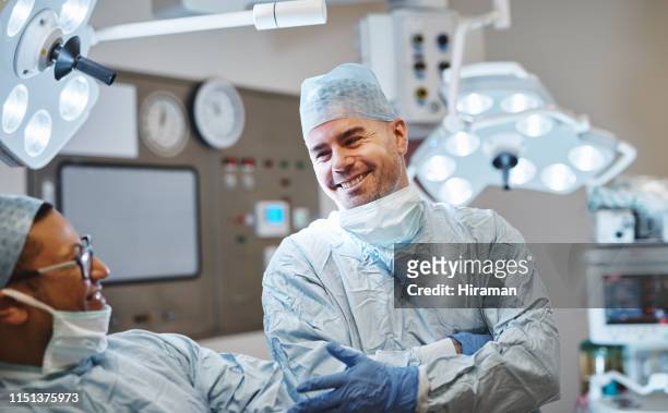 maintaining good rapport with peers is part of professionalism - surgeon patient stock pictures, royalty-free photos & images