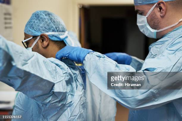 first rule of the operating room: keep it clean - protective workwear imagens e fotografias de stock