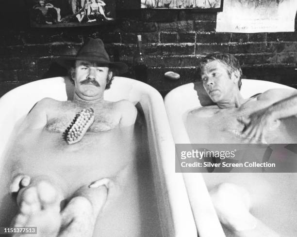 American actors Gene Hackman as Sam Clayton and James Coburn as Luke Matthews in the Western 'Bite the Bullet', 1975.