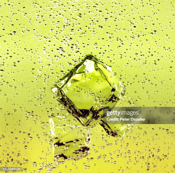 ice cubes in refreshing lemon and lime drink - ice cubes background ストックフォトと画像