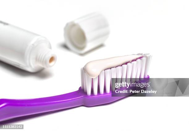 toothbrush with toothpaste - toothpaste stock pictures, royalty-free photos & images