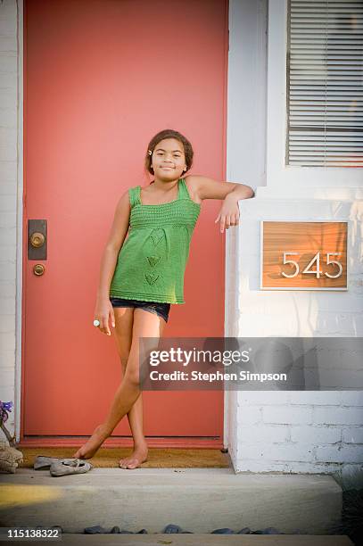 simple portrait, girl in doorway - kid leaning stock pictures, royalty-free photos & images