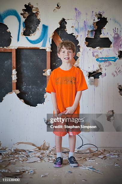 boy demolishing kitchen drywall - destruction stock pictures, royalty-free photos & images