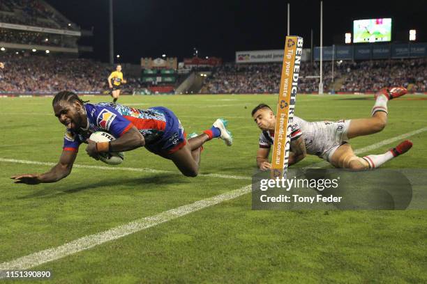 Edrick Lee of the Newcastle Knights scores a try during the round 11 NRL match between the Newcastle Knights and the Sydney Roosters at McDonald...