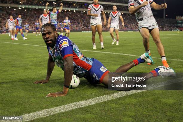 Edrick Lee of the Newcastle Knights scores a try during the round 11 NRL match between the Newcastle Knights and the Sydney Roosters at McDonald...