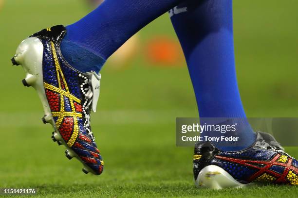 Player boots painted in traditional Aboriginal dots during the round 11 NRL match between the Newcastle Knights and the Sydney Roosters at McDonald...