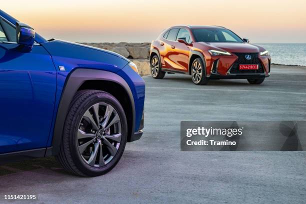 lexus ux 250h vehicles during the daybreak - lexus stock pictures, royalty-free photos & images