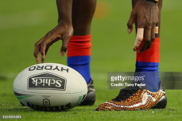 Player boots painted in traditional Aboriginal dots during the round 11 NRL match between the Newcastle Knights and the Sydney Roosters at McDonald...