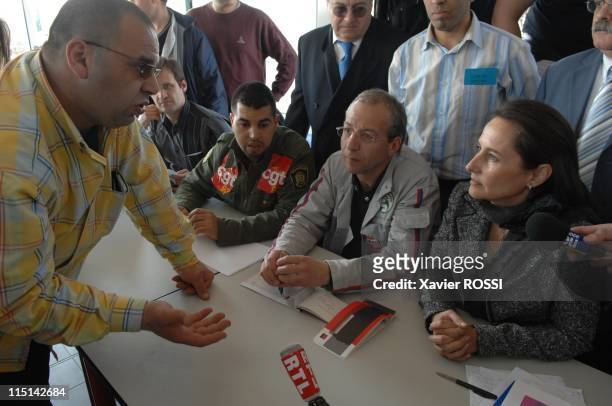 Segolene Royal , France's Socialist Party presidential candidate, meets automaker PSA Peugeot Citroen workers on strike in front of the PSA plant in...