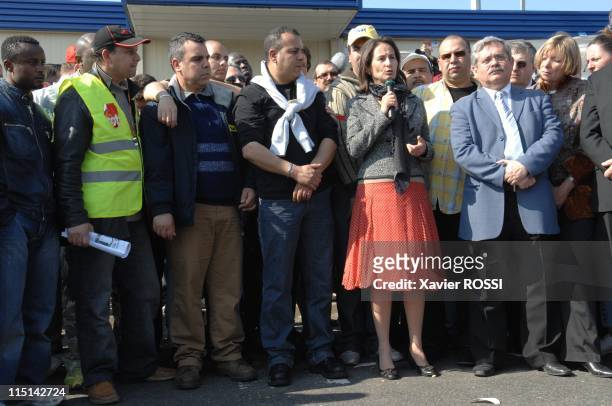 Segolene Royal , France's Socialist Party presidential candidate, meets automaker PSA Peugeot Citroen workers on strike in front of the PSA plant in...
