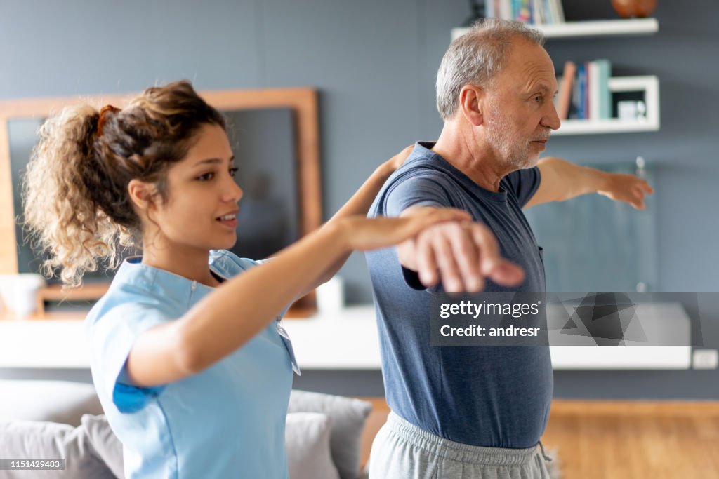 Nurse making a house visit to a senior patient